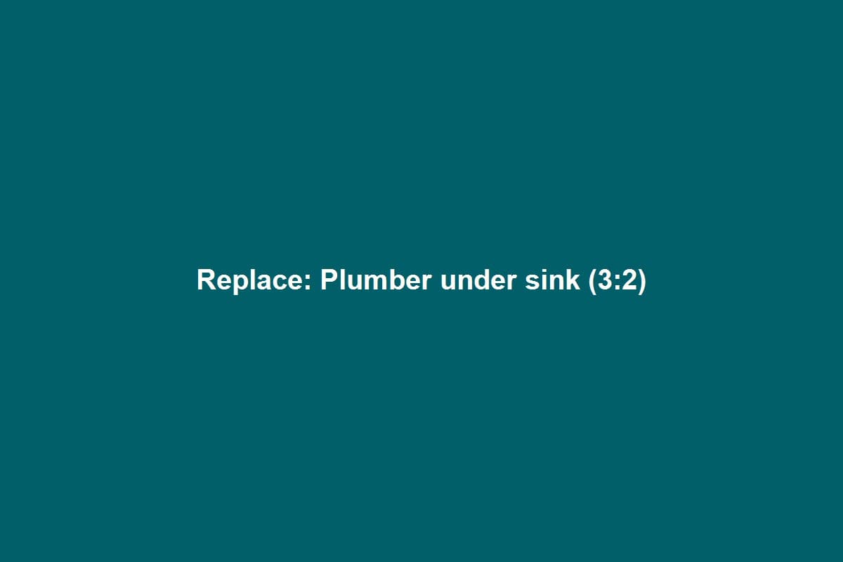 Plumber installing supply lines under a residential kitchen sink