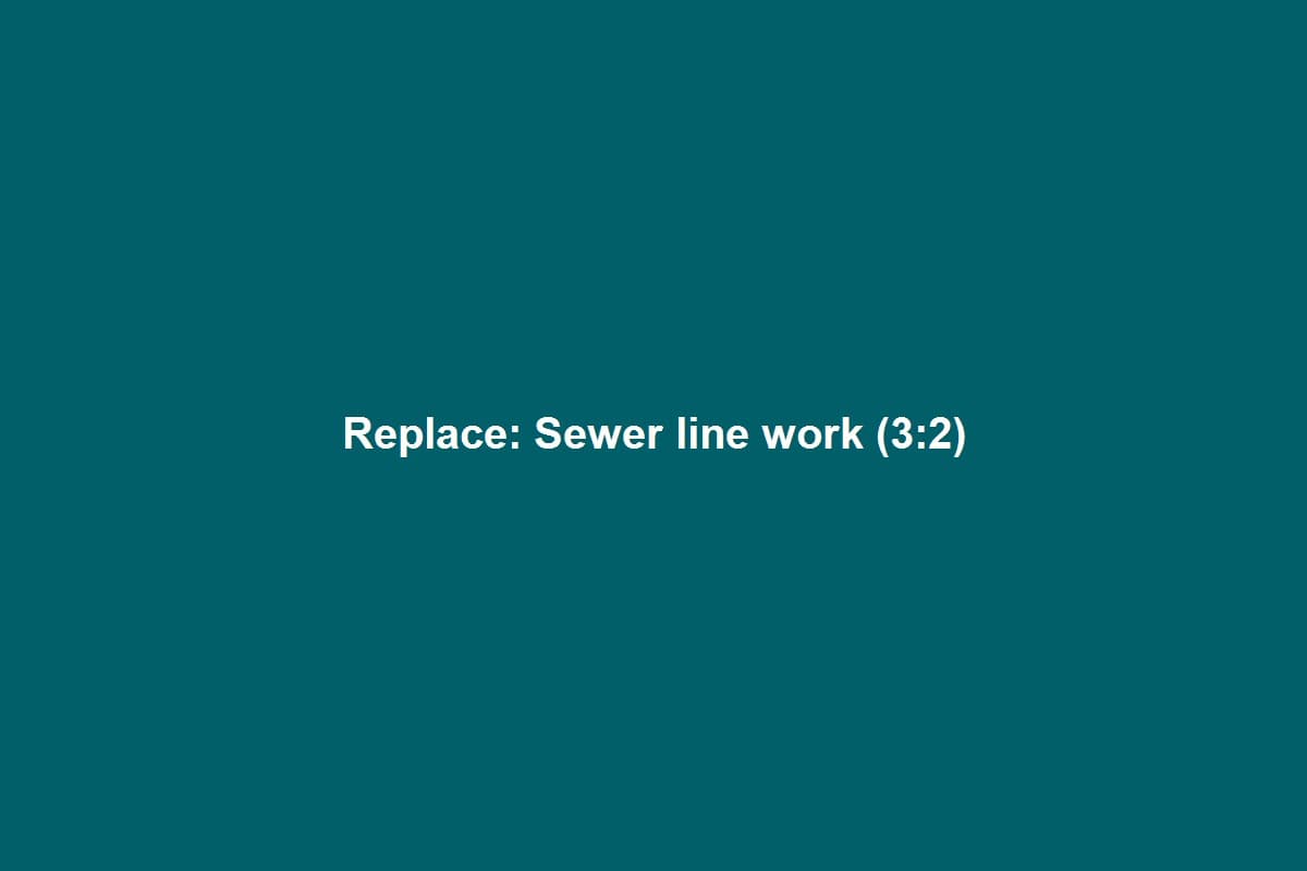 Plumber repairing a residential sewer line with PVC pipe